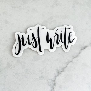 May include: A white sticker with black lettering that reads "just write".