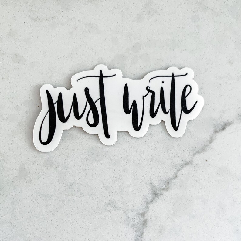 May include: A white sticker with black lettering that reads "just write".
