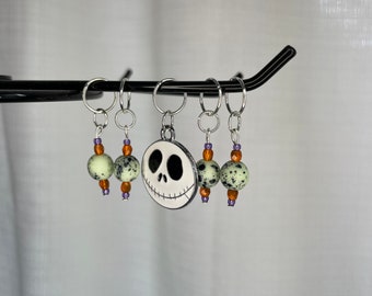 Mint green/black speckle with orange/purple accent glass bead stitch marker set with enamel Jack Skellington charm