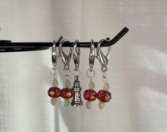 Rust with cream accent glass bead locking stitch marker set with lighthouse charm