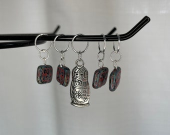 Marbled black with pink inlay glass bead stitch marker set, Russian nesting doll charm