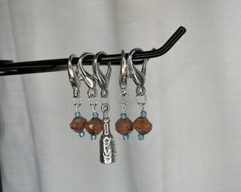 Peach/bronze with light blue accent glass bead locking stitch marker set with wine bottle charm