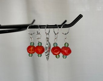 Orange with green accent glass bead stitch marker set with seashell charm