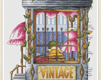 May include: A vintage shop storefront with a pink umbrella, a window display of clothing, and a sign that reads "VINTAGE".