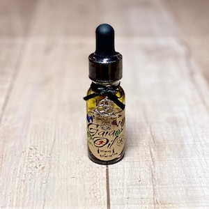 Gaia’s Oil-Offering and Ritual Oil- Made With 100% Essential Oil’s, Herbs and Botanicals, Gold and Crystals