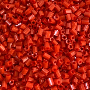 Size 11 Bright Red Hexagon Glass Seed Beads. 25 grams.