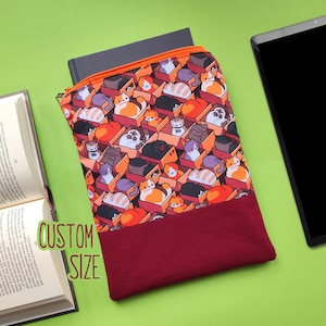 May include: A rectangular fabric pouch featuring a repeating pattern of cartoon cats in cardboard boxes, with an orange zipper closure and a solid dark red bottom section. The text "CUSTOM SIZE" is printed in green near the pouch.