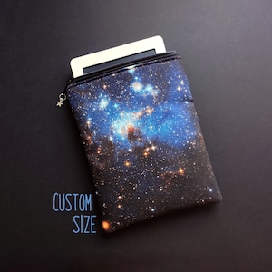 May include: A set of three ceramic mugs with a speckled, matte finish. The mugs are in shades of cream, light gray, and dark gray. Each mug has a simple, minimalist design, perfect for coffee or tea.