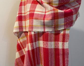A soft handwoven lambswool scarf in bright spring colours