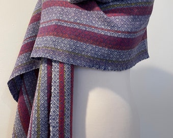 A soft handwoven lambswool scarf multicoloured with blue overlay