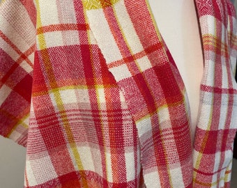 A soft handwoven lambswool scarf in spring colours