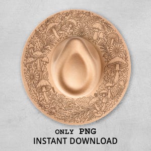 Può includere: Un cappello fedora beige con un design inciso di funghi, fiori e foglie sul bordo. Il cappello ha una classica corona a goccia e un'ampia tesa. Il testo "ONLY PNG INSTANT DOWNLOAD" è in basso.