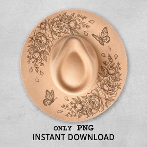 May include: A tan fedora hat with a floral and butterfly design. The hat features a wide brim and a center crease. The design includes peonies, leaves, and butterflies. The text "ONLY PNG INSTANT DOWNLOAD" is at the bottom.