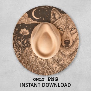 May include: A tan fedora hat with a detailed wolf design on the brim. The brim features a wolf's head, flowers, a crescent moon, and the text "ONLY PNG INSTANT DOWNLOAD".