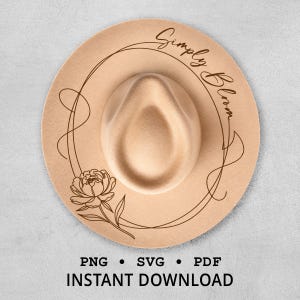 May include: A beige fedora hat with a decorative floral design and the words "Simply Bloom" in a cursive font. The hat has a circular design with a flower and the text "PNG SVG PDF INSTANT DOWNLOAD".
