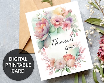 May include: A digital printable thank you card with a watercolor floral design. The card features pink, purple, and green flowers with the words "Thank you" in black calligraphy.