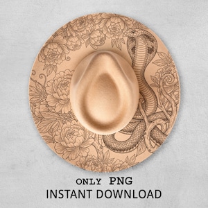 May include: A tan fedora hat with a detailed floral and snake design. The hat features a beige crown and brim, with the brim displaying a laser-etched cobra and floral pattern. The text "ONLY PNG INSTANT DOWNLOAD" is printed at the bottom.