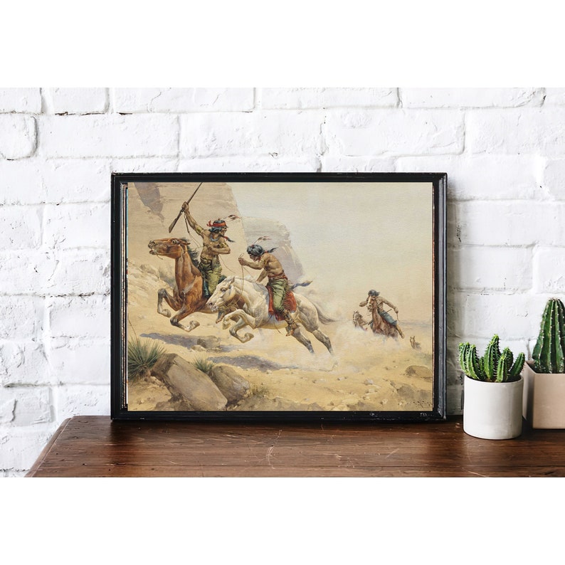 May include: A vintage painting depicting Native American warriors on horseback riding through a desert landscape. The warriors are wearing traditional clothing and carrying weapons. The painting is framed in a black frame.