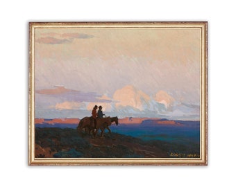 May include: A painting of two figures on horseback riding through a desert landscape under a cloudy sky. The sky is a pale pink and blue with large, fluffy clouds. The figures are silhouetted against the sky, and the horses are brown. The painting is framed in a gold frame.
