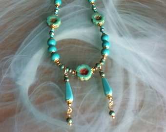 Necklace and earrings, Art Nouveau style composed of round beads, flowers, elongated Bohemian glass beads, Turquoise and gold plated beads