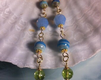Long earrings with faceted Czech glass beads, blue opal Swarovski crystal beads, and peridot beads for a lovely contrast
