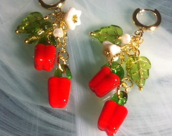 Earrings featuring handcrafted Murano glass chili peppers to spice up your holidays and white Czech glass flowers
