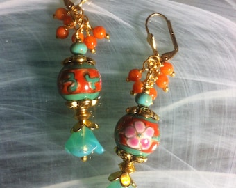 Victorian style fantasy earrings featuring a cloisonné center bead and turquoise Czech glass flowers