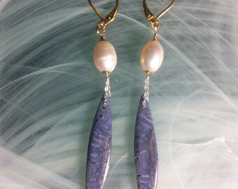 Earrings featuring blue coral marquise beads suspended from an extra-fine 925 sterling silver chain and a freshwater pearl