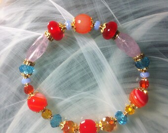 Multicolored multi-crystal bracelet in vibrant summer colors featuring agate beads, elongated Amethysts, Czech glass, and Swarovski crystal