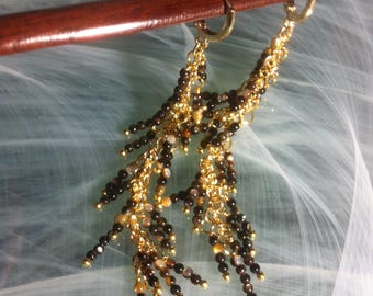 Cascading earrings with stems of four or five tiny 2.5mm mother-of-pearl beads stacked on a delicate 14K gold-plated chain