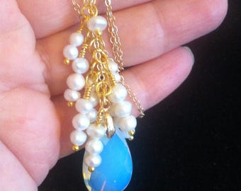 Pendant with a faceted Opalite Quartz crystal on a fine gold-plated chain and cascading small white freshwater pearls