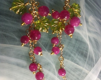 Long earrings for spring flowers with strawberry Quartz beads like small fruits and Czech glass leaves in transparent green with gold vein