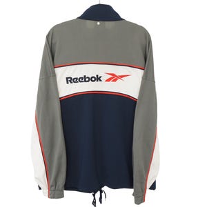 ヴィンテージ REEBOK トラックジャケット フルジップ サイズ XXL 90年代 ビッグロゴ スポーツ ウィンドブレーカー グレー ブルー