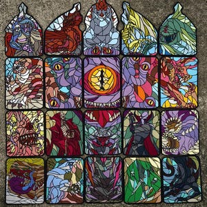 May include: A selection of colourful, stained-glass style patches depicting various fantasy creatures and monsters. Each patch has a unique design with intricate details and vibrant colours, including red, purple, and green.