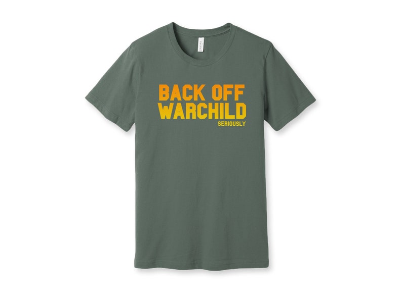 May include: A dark green t-shirt with the text "BACK OFF WARCHILD SERIOUSLY" printed in orange and yellow.