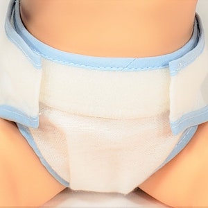 May include: A white cloth diaper with blue trim. The diaper is folded and ready to be used.