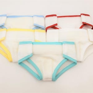 May include: Four reusable cloth diapers with different colored trim. The diapers are white with a blue, red, yellow, and turquoise trim.