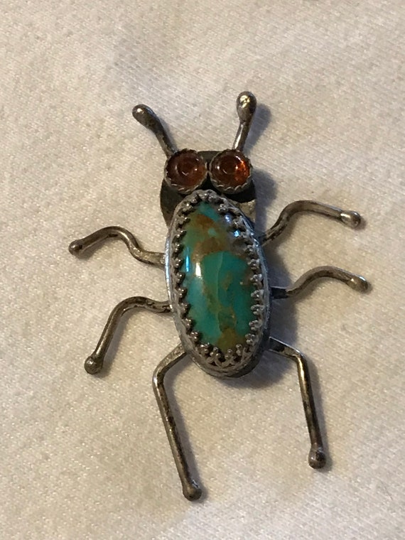 Silver and Turquoise Bug