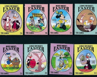 May include: A sheet of eight postage stamps featuring Disney characters celebrating Easter. The stamps showcase Mickey Mouse, Donald Duck, Goofy, and Ludwig Von Drake with Easter eggs and bunnies. The stamps are from The Gambia.