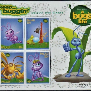 May include: A set of four postage stamps featuring characters from the Disney Pixar movie "A Bug's Life". The stamps are from Palau and feature a blue ant, a purple ant, a yellow ant, and a green caterpillar. The stamps are all 20 cents.