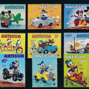 Disney Antigua 1980 conjunto de 9 sellos postales y una hoja de recuerdo Scott #562-71 MNH arte varios personajes de Disney en escenas de transporte