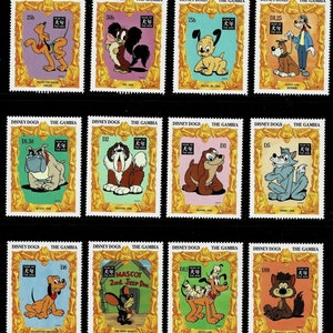 May include: A sheet of Disney Dogs postage stamps from The Gambia. The stamps feature various cartoon dogs, including Pluto, Goofy, and others, in colorful designs. Each stamp is framed with a gold border and includes text such as "Year of the Dog."