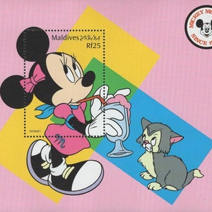May include: A colorful stamp featuring Minnie Mouse drinking a milkshake with Figaro the cat. The stamp is from the Maldives and has a Mickey Mouse logo. The background has geometric shapes in pink, yellow, and blue.