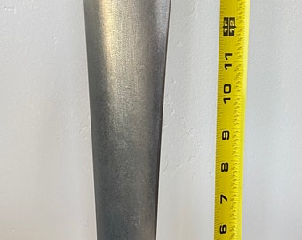 May include: A silver metal propeller blade, approximately 16 inches long, is displayed on a black stand with the text "STRATOFORTRESS" printed on it. A yellow measuring tape is next to the stand.