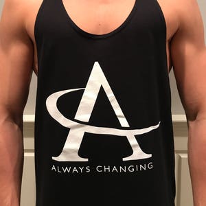 May include: Black tank top with a white graphic of a stylized letter A with a curved line around it. The text "ALWAYS CHANGING" is printed below the graphic.