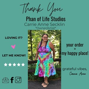 A woman wearing a colorful tie-dye dress stands in front of a green background. The text 'Thank You' is at the top of the image and 'Phan of Life Studios' is below it. 'Carrie Anne Secklin *Owner/Artist*' is below the business name. Text reads 'LOVING IT?' 'LET ME KNOW!'  Five stars are below the 'LET ME KNOW!' text. The text 'your order = my happy place!' is in the upper right corner of the image. The text 'grateful vibes, Carrie Anne' is in the lower right corner of the image.