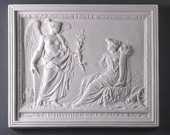May include: A white plaster relief sculpture depicting two figures, one with wings and a laurel branch, the other seated with a sheaf of wheat. The inscription reads "L'HISTOIRE ET LA PAIX".