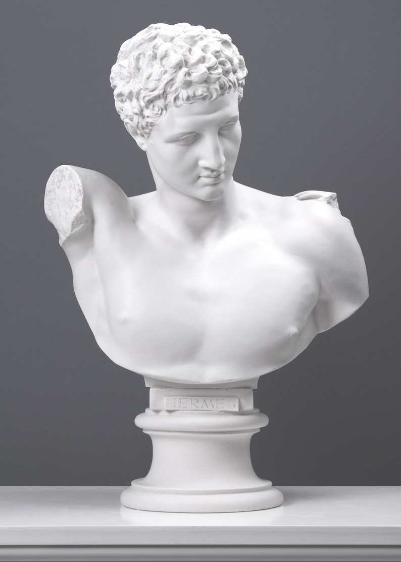 May include: White plaster bust sculpture of Hermes, the Greek god of commerce, trade, and thieves. The bust is on a white pedestal with the word "Hermes" inscribed on the front.