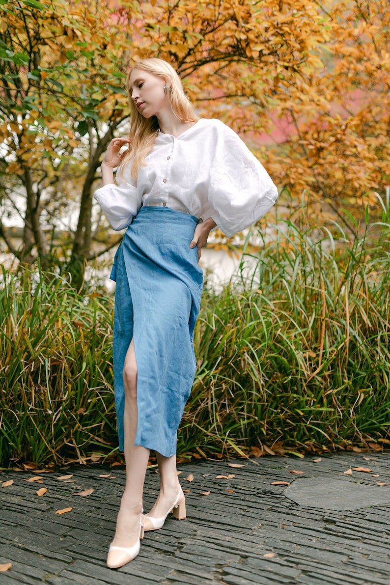 Stylish and elegant woman in an autumn garden posing in an organic linen wrap pencil skirt with pockets, Long high waisted skirt for natural and trendy look of a modern confident woman.