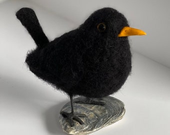A needle felted blackbird, needle felted British bird